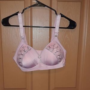 No brand bra has a small dot on the inside cup